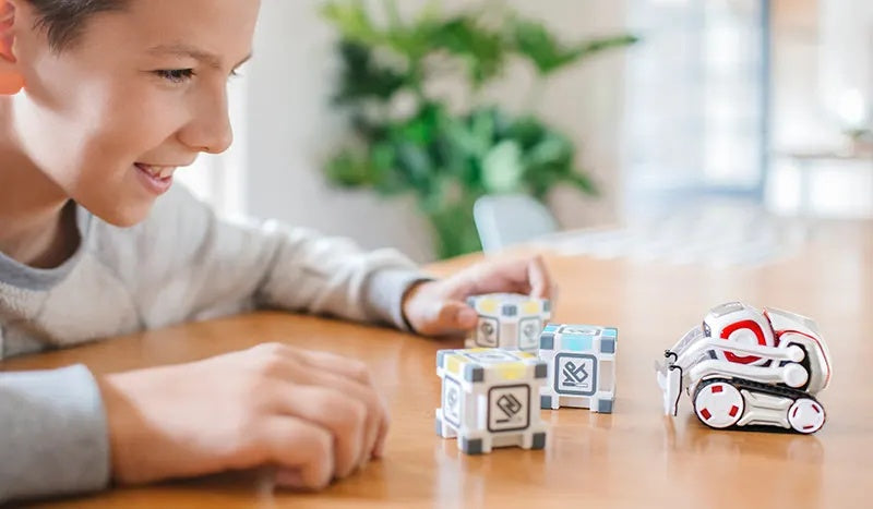 Boy Looking At Cozmo Looking At Cubes